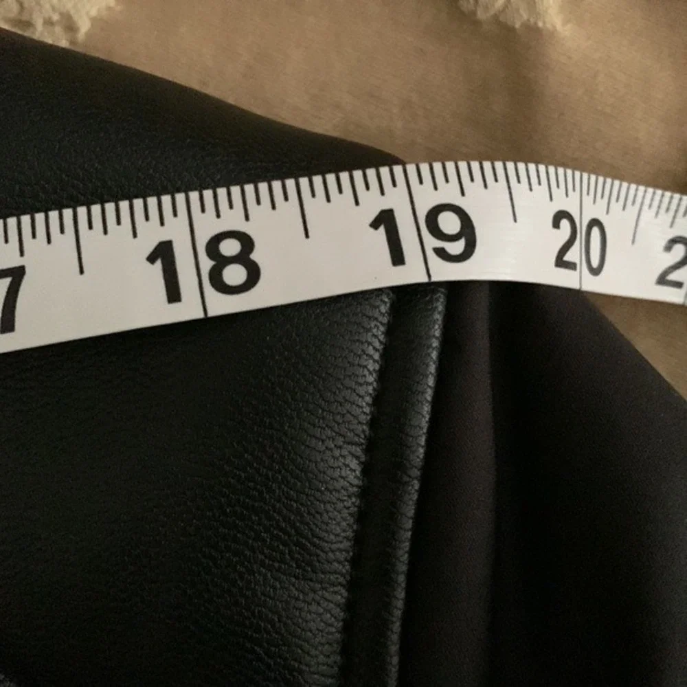 PRONTO UOMO. NWOT. Black jacket w/faux leather trim on shoulder. Three pockets.